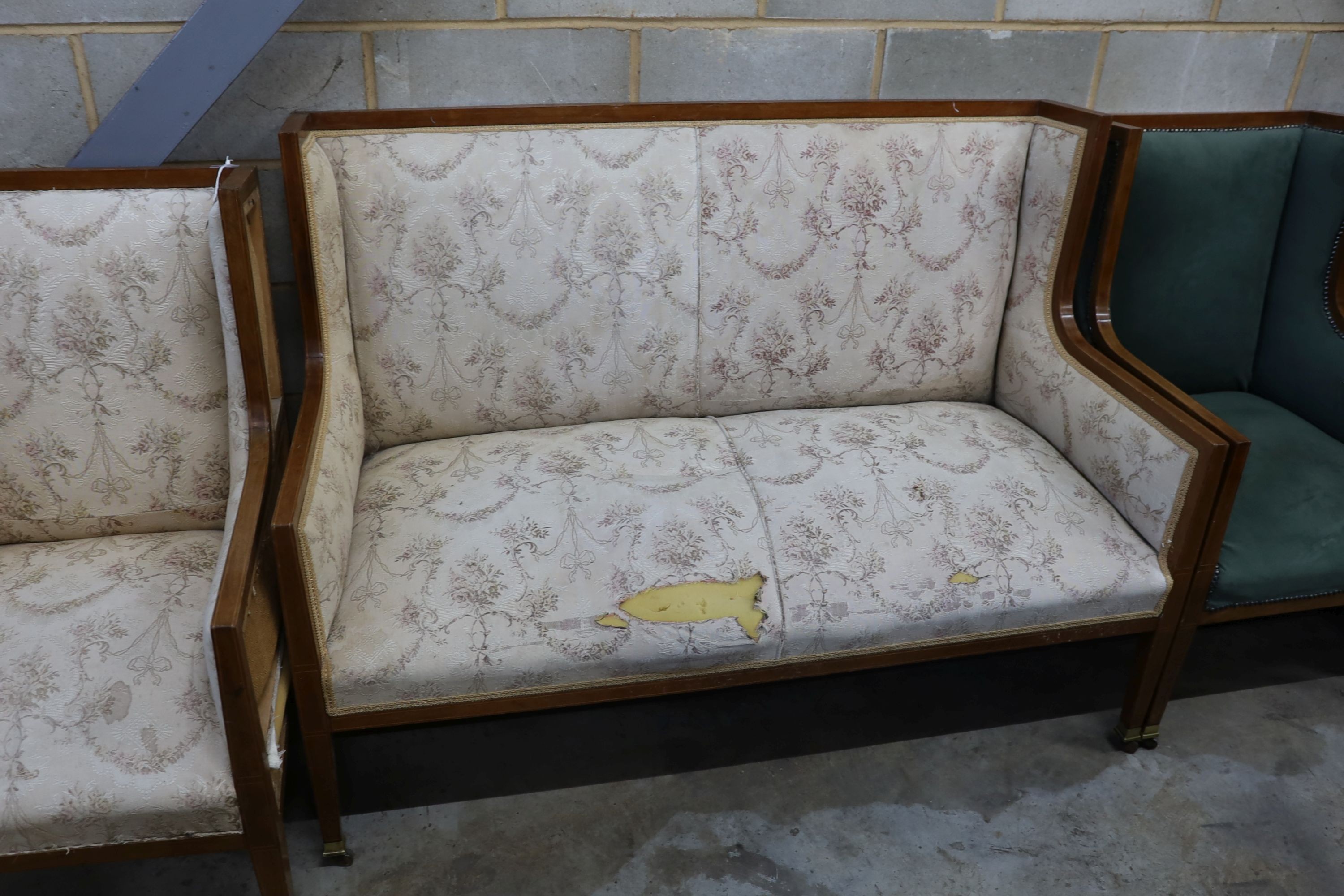 An Edwardian inlaid mahogany three piece salon suite, settee length 143cm, depth 70cm, height 104cm